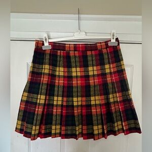 Red and yellow wool kilt with pin
